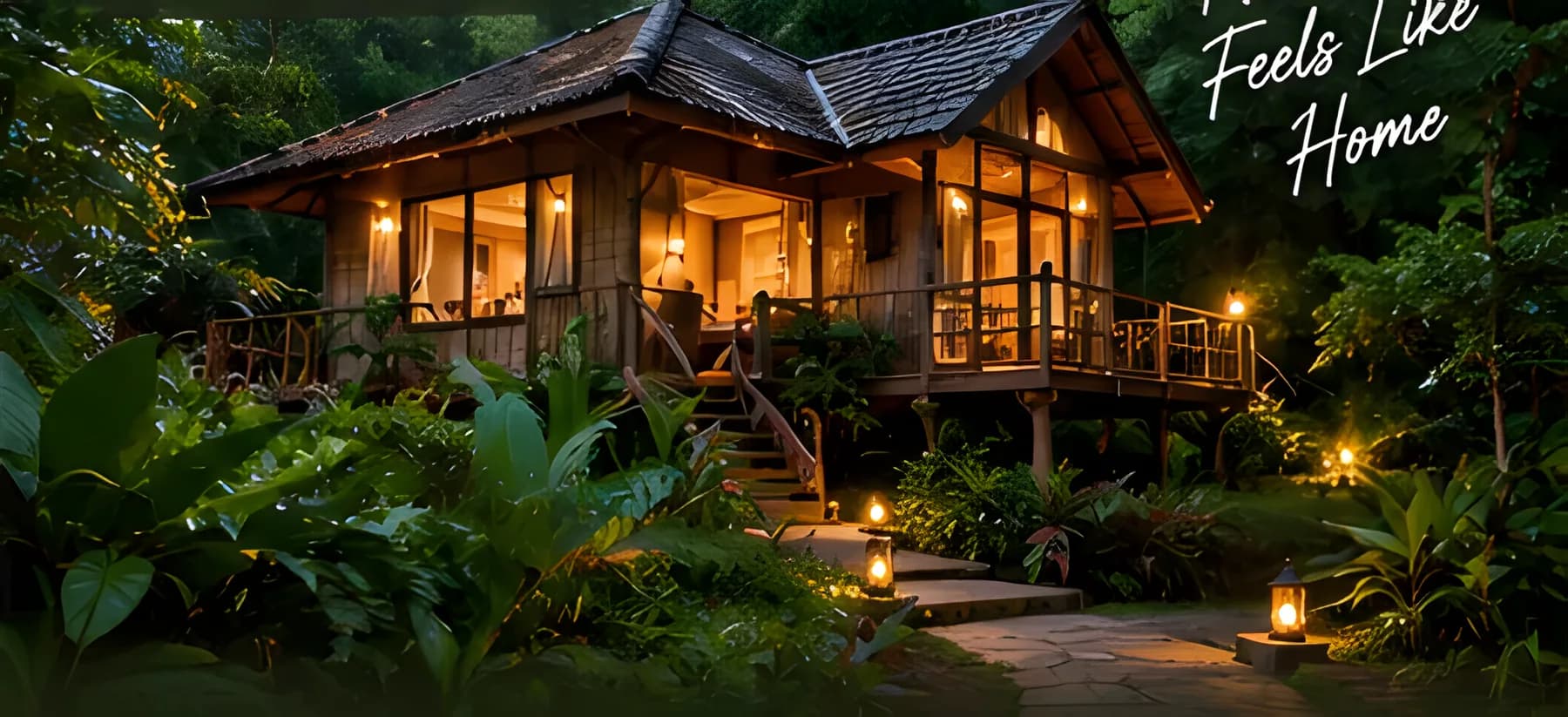 Timber jungle cottage with a lit verandah